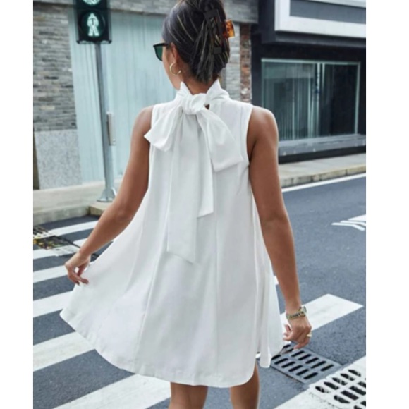 Dresses & Skirts - Luxe white tie back mini dress